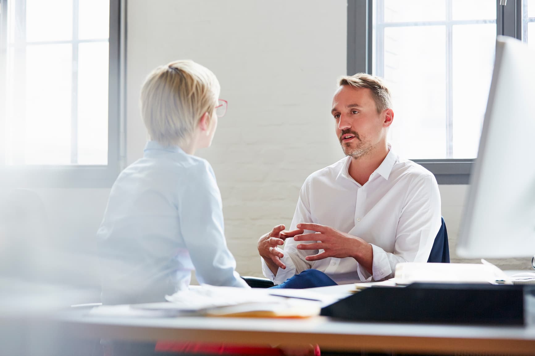 Immigration attorneys meeting with clients